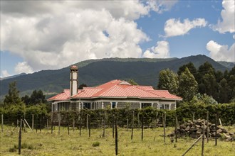 Modern residential house in Africa with a fence. Accommodation in Kenya. Magnificent cityscape