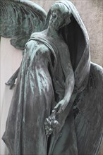 Cemetery mourning statue of a woman