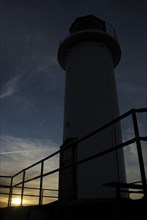 Sunset at the lighthouse on the south pier, Ventspils, Latvia, Europe