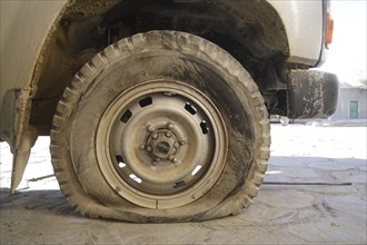 Flat tire on off-road vehicle in Bolivia