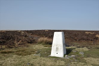 The trig point at high brown knoll between wadworth and midgley moor in calderdale west yorkshire