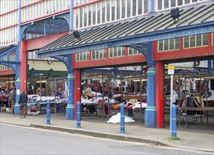 Huddersfield, west yorkshire, United Kingdom, 20 May 2019: people walking and shopping at stalls in