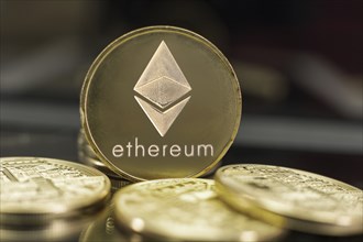 Ethereum coin and defocused background. Digital cryptocurrency concept