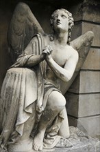 Cemetery mourning angel statue