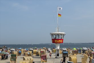 Summer weather, bathers, beach chairs and DLRG lifeguard tower on the beach, Travemünde beach,