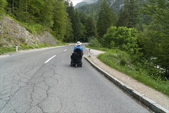 Disabled person in an electric wheelchair on the street