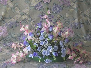 Flower arrangement on floral background