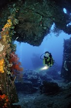 Two divers examine the Liberty shipwreck, Bali, Tulamben, Indian Ocean, Indonesia, Asia