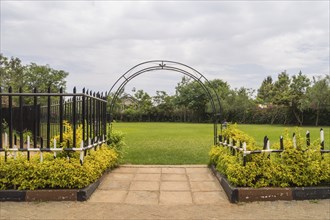 Entrance to a flower park with a barrier and an ark in the city of Nairobi Kenya