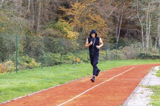 Young man jogging in the morning outdoor on the running race track