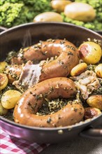 Kale with Bregenwurst sausage and roast potatoes