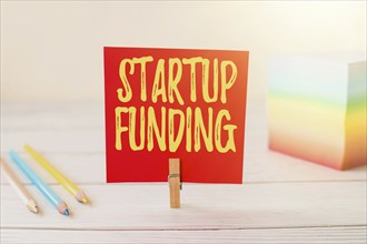 Sign displaying Startup Funding, Concept meaning financial investment in the development of a new