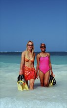 Two snorkellers on the beach, Punta Cana, Caribbean, Dominican Republic, Central America