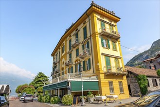 Yellow house in Varenna, beautiful village on lake Como, Italy, Europe