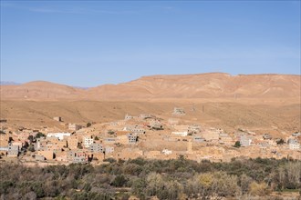 A panoramic view of a city in the Atlas Mountains, with its ancient medina, fortress walls, and