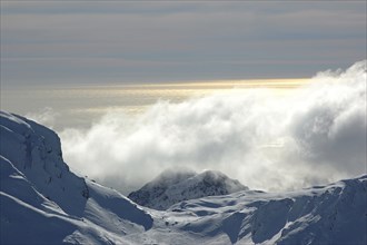 Cloud-covered snowy peaks in the Southern Alps, Westland, New Zealand, Oceania