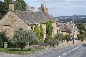 Row of traditional houses in Cotswold village of Bourton on the Hill