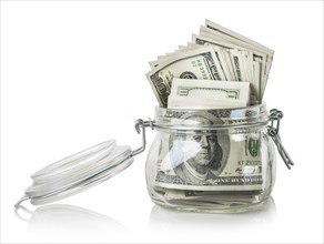 Glass jar with dollars isolated on a white background