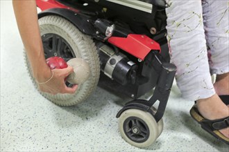 Disabled Boccia player training on a wheelchair