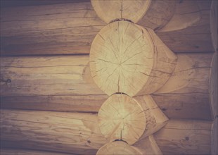 Architectural image with the exterior corner and part of the wall of a log house, traditional built