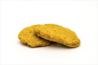 Slice of fresh breaded chicken on a white background