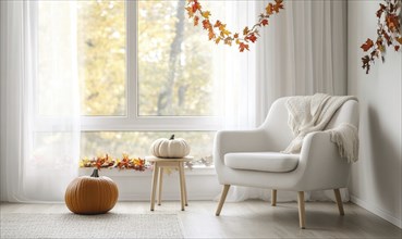 Scandinavian living room with a white armchair, light wooden side table, autumn leaves garland, and