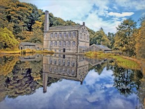 Watercolor painting of gibson mill a water powered mill with main bulding relected in the pond in