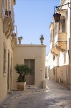 Street in Medina with traditional closed balconies