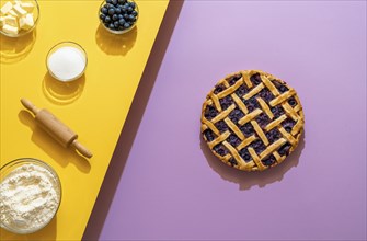 Making a blueberry pie from scratch with butter, sugar, flour, and fruits, on a seamless background