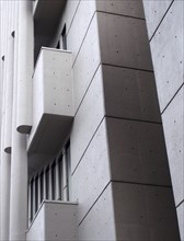 Angles corners and geometric shapes on the exterior wall of a 1960s concrete brutalist building