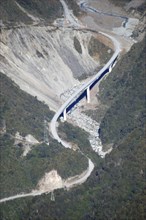 Otira Viaduct at Arthur's Pass, West Coast, South Island, New Zealand. Old road winds up the hill