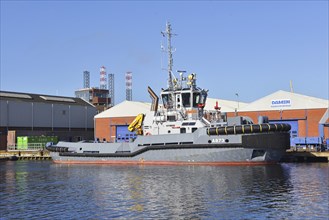 Den Helder, Netherlands. April 2023. A tug and an oil rig in Den Helder harbor