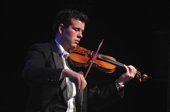 Violinists performing in live concert