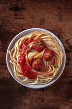 Meatballs. Beef meat balls, shot from above with spaghetti pasta, parsley, and tomato sauce, on a