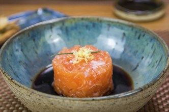 Salmon tartare deliciousness in a beautiful decorated plate