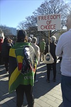 CHRISTCHURCH, NEW ZEALAND, JULY 24, 2021, People at a protest rally at the Bridge of Remembrance in