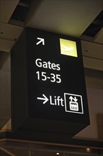 Airport signage directing passengers to departure gates