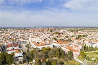 Evora drone aerial view on a sunny day with historic buildings city center and church in Alentejo,