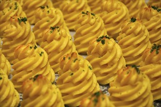 Spirals of mashed potato cooked and ready to serve