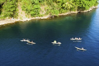 Inhabitants with outrigger boats, Tufi, Cape Nelson, Papua New Guinea, Oceania