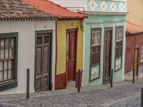 Colourful facades with old doors and windows along a cobbled street in the old town, la palma,