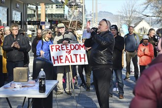 CHRISTCHURCH, NEW ZEALAND, JULY 24, 2021, A man speaks at a protest rally at the Bridge of