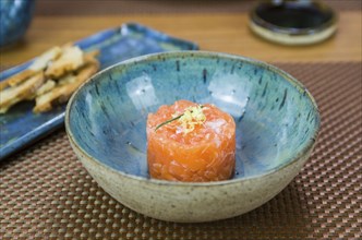 Salmon tartare deliciousness in a beautiful decorated plate