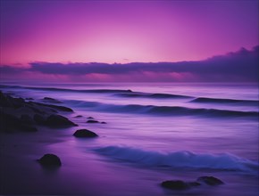 Calm seashore with waves crashing on rocks under a purple-pink sunset, AI generated