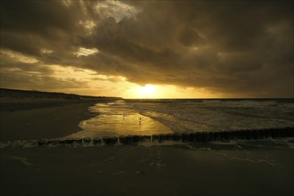 View over the bunes into the baltic sea at sunset. special light atmosphere at a vacation resort