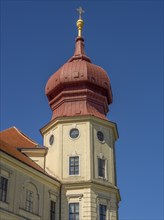 Baroque tower with red roof under a bright blue sky, Dürnstein, Wachau, Danube, Austria, Europe