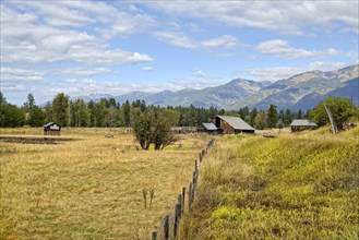 An old barn in a pasture With the MIssion mountains in the background near St. Ignatius, Montana