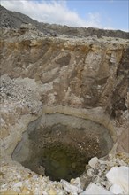 An exploratory hole reveals the depth of a seam of diamataceous earth at a mine in Queensland,