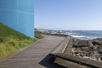 Passadiço das Ondas boardwalk, rocks and surf on the beach promenade in Nevogilde, Norte region,