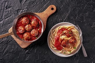 Meatballs. Beef meat balls, Italian dish, overhead flat lay shot in a pan and with a plate of